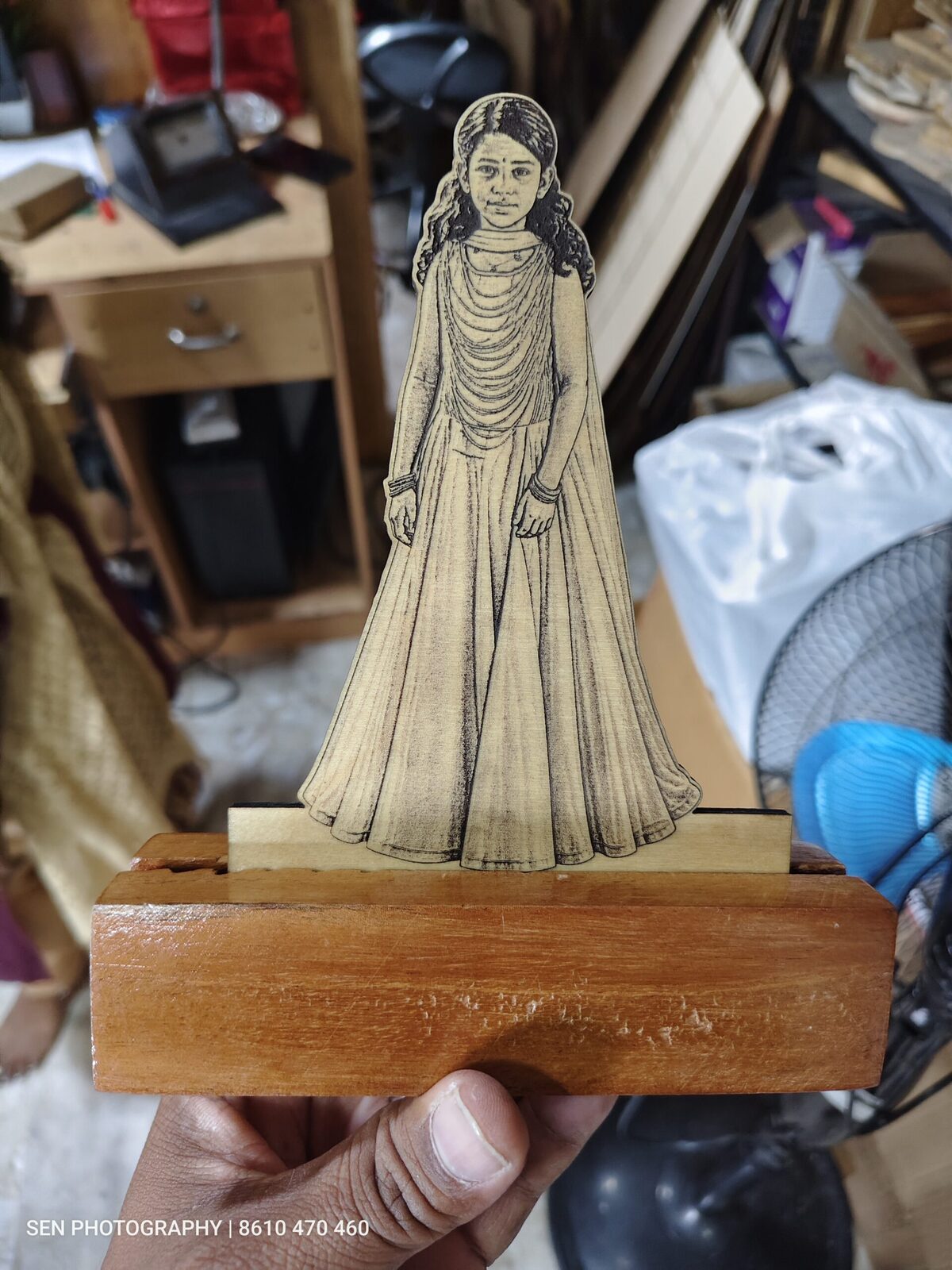 Wooden engraved photo cutout standee of a girl on a wooden base