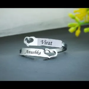 Matching couple name bands engraved with two names and a heart