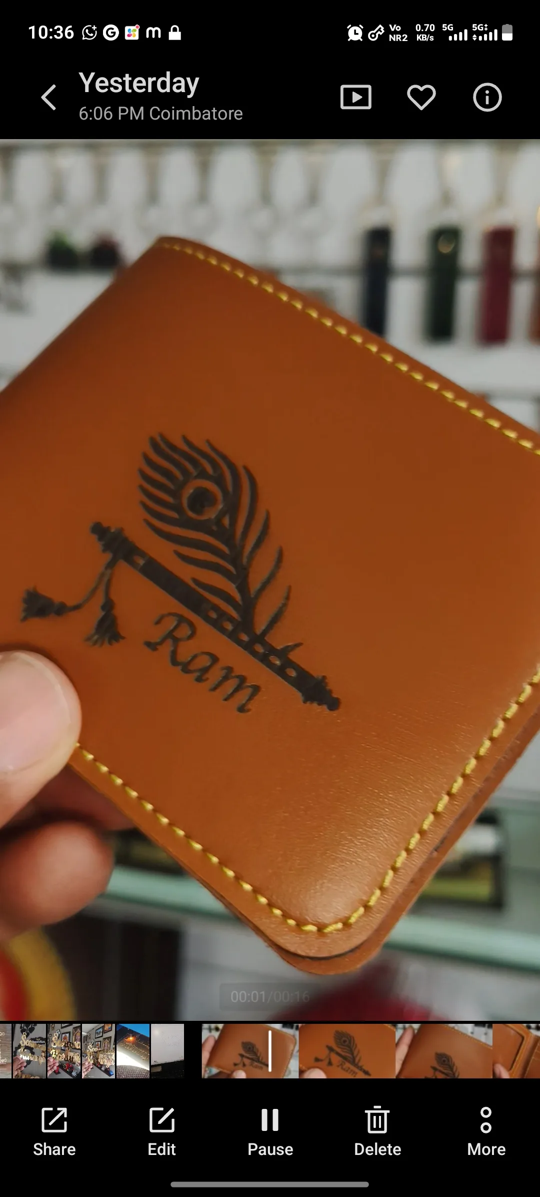 Tan leather wallet laser engraved with a name and peacock feather design